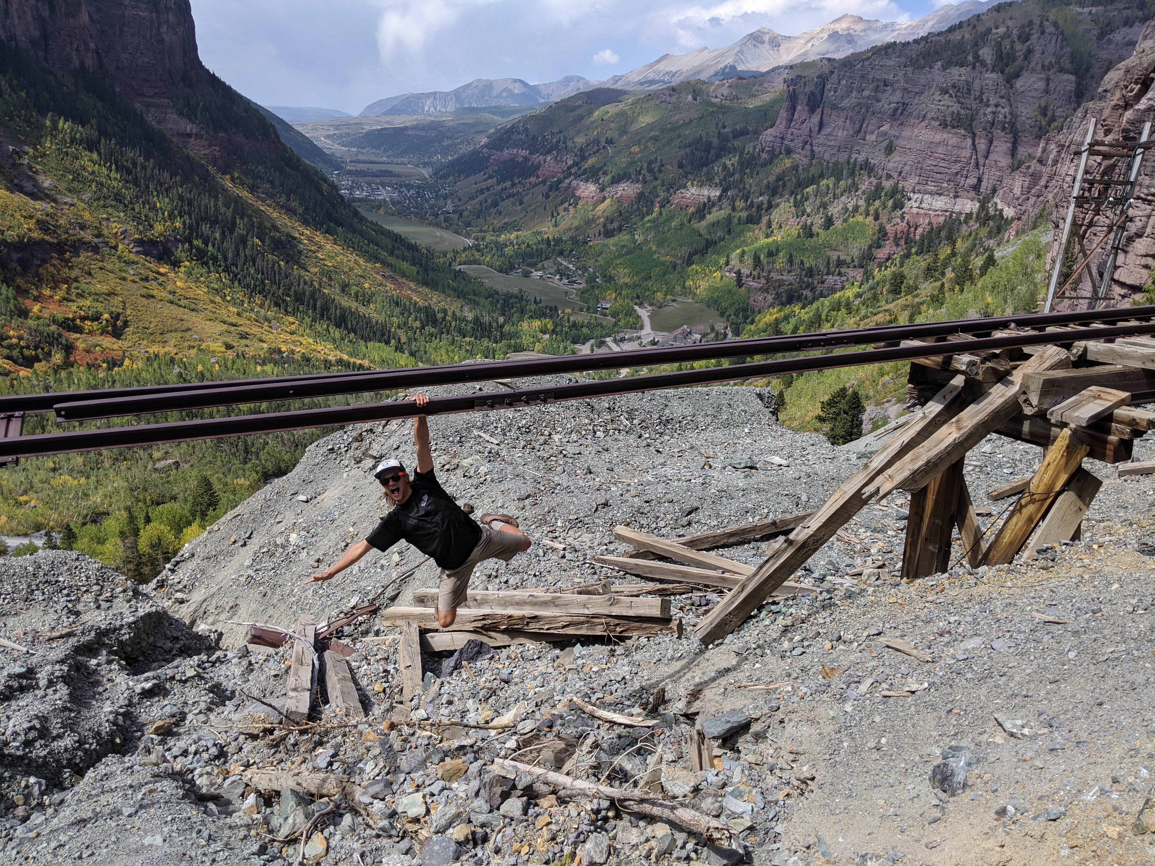 Hanging off of an abandoned minecart rail